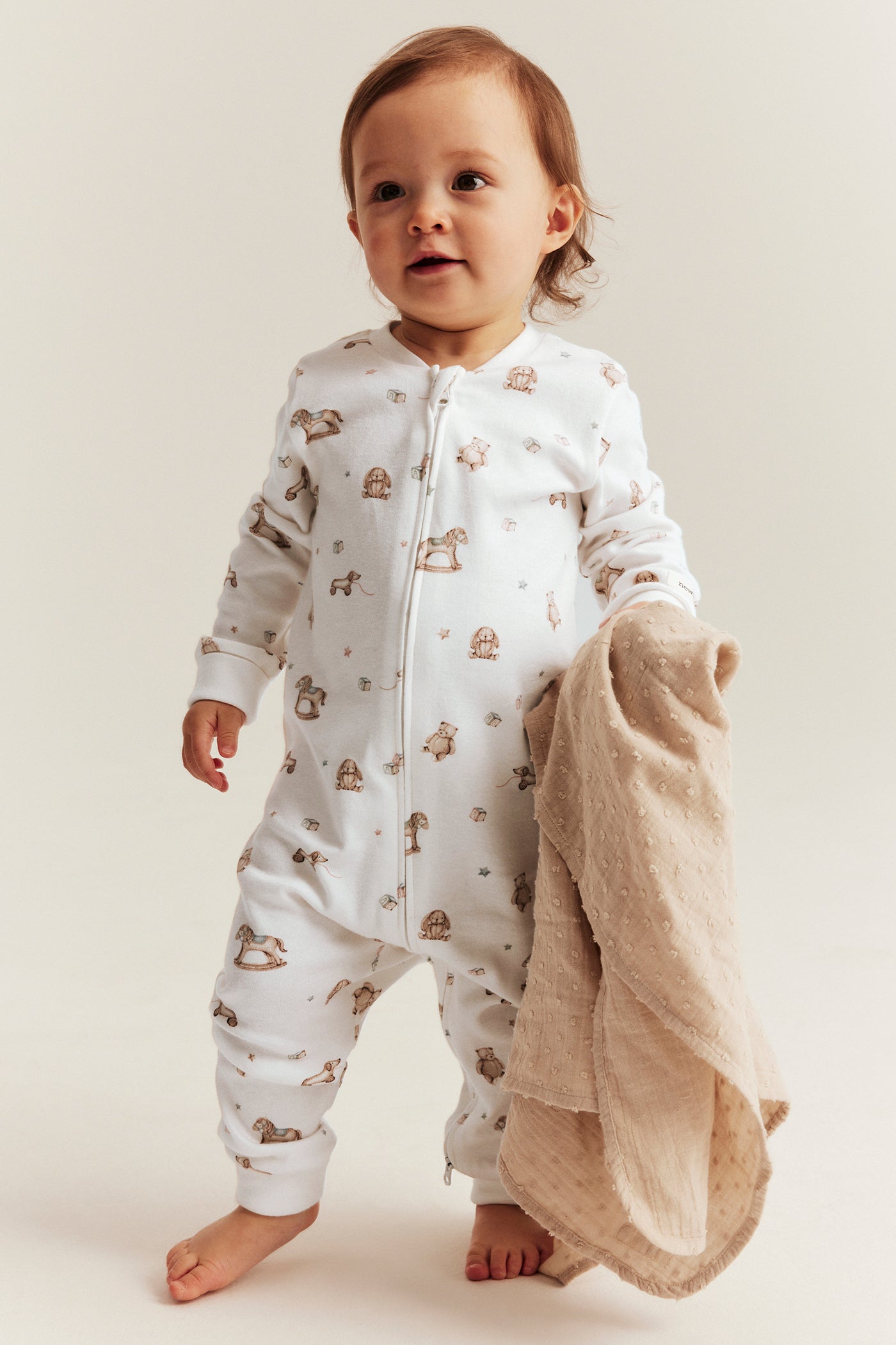 Baby white toy patterned sleepsuit