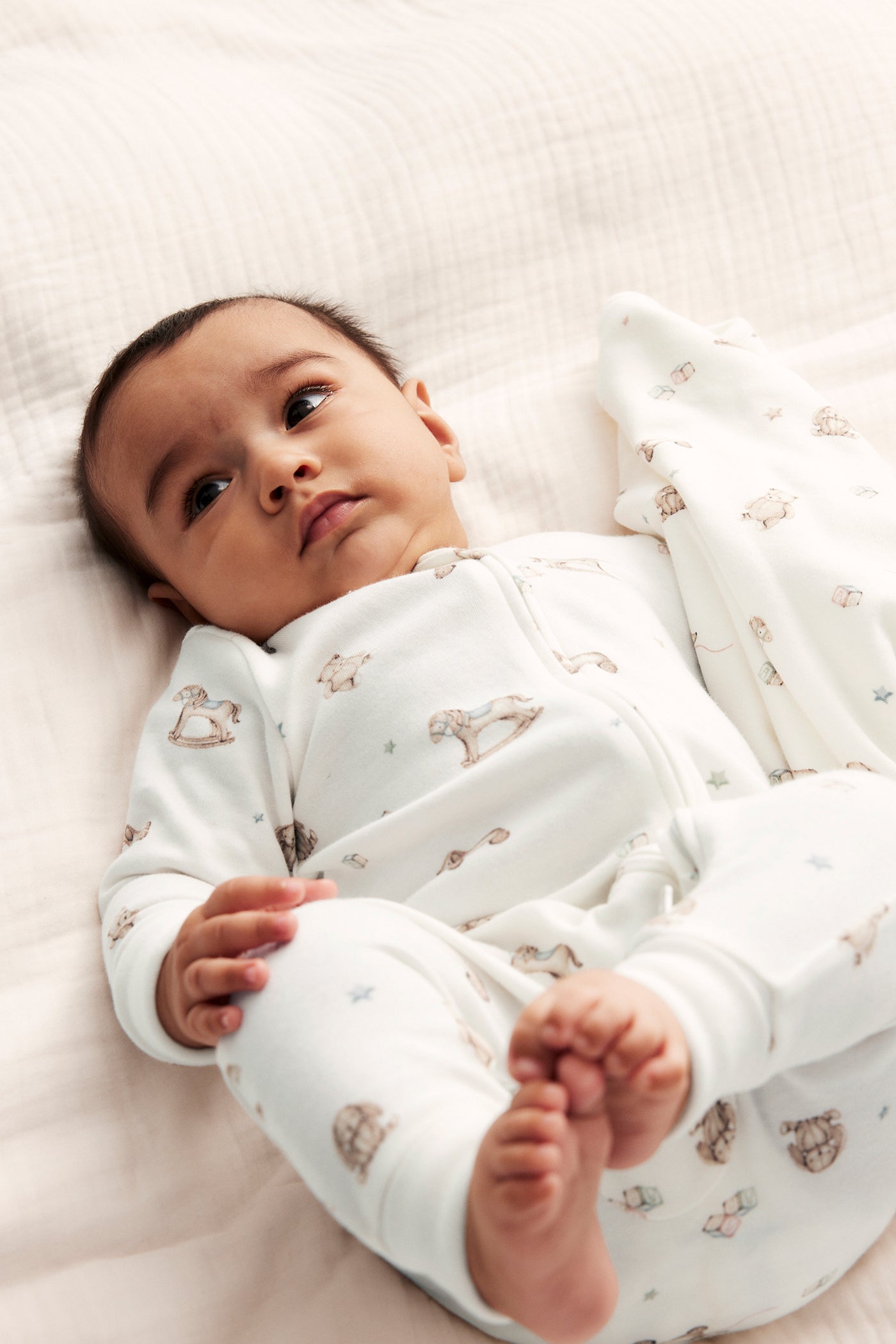 Baby white toy patterned sleepsuit