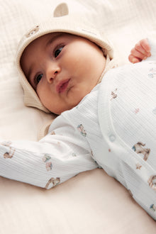 Baby white bodysuit with toys