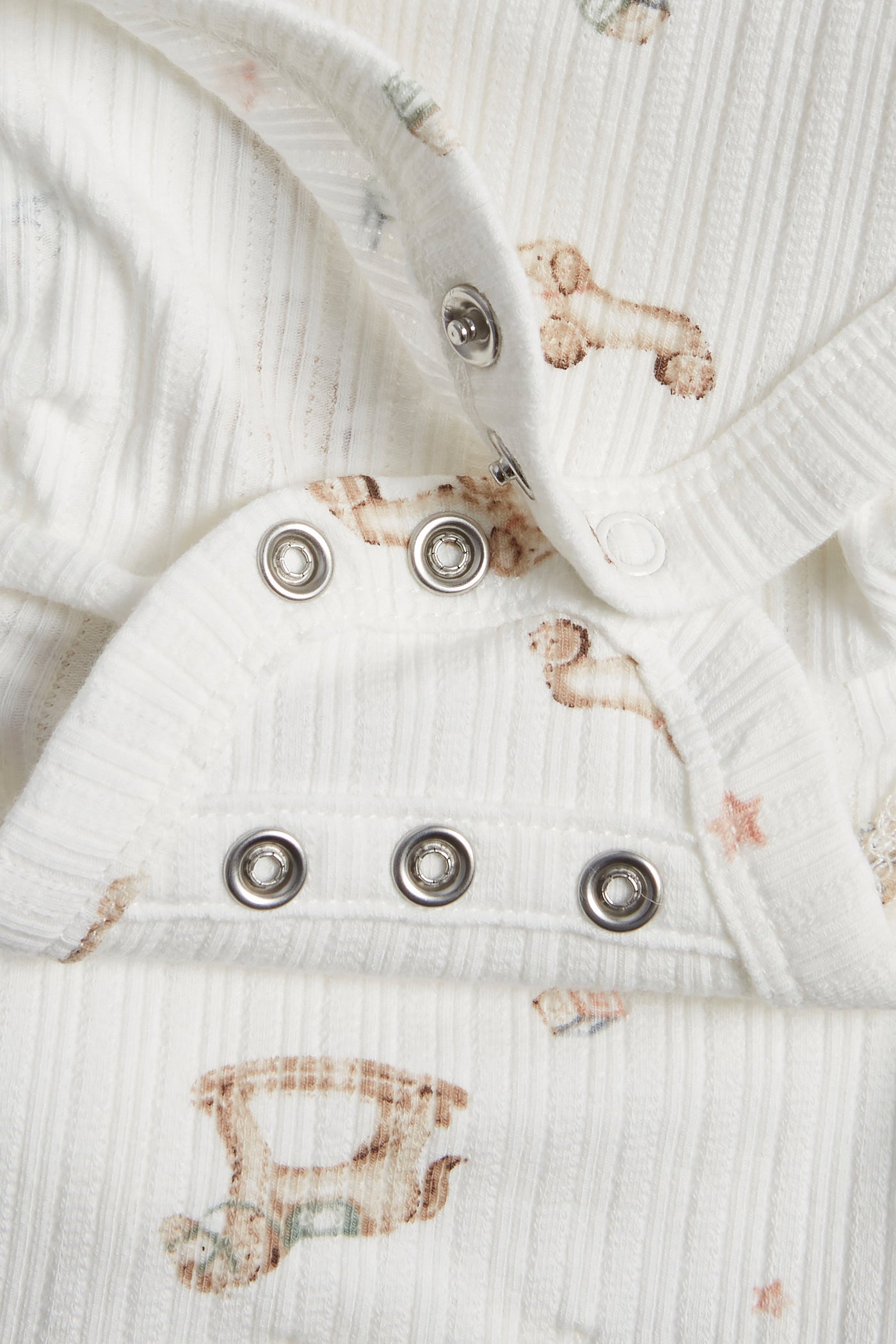 Baby white bodysuit with toys