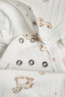 Baby white bodysuit with toys