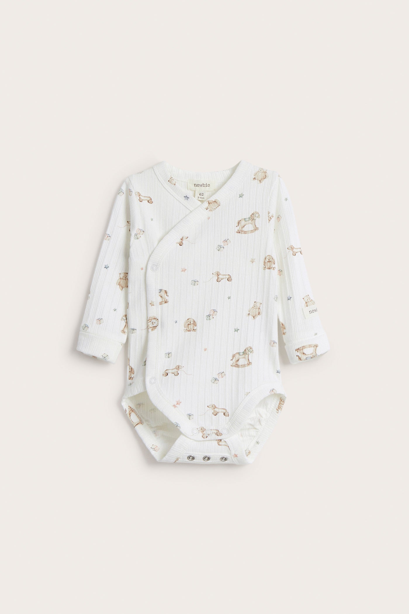 Baby white bodysuit with toys