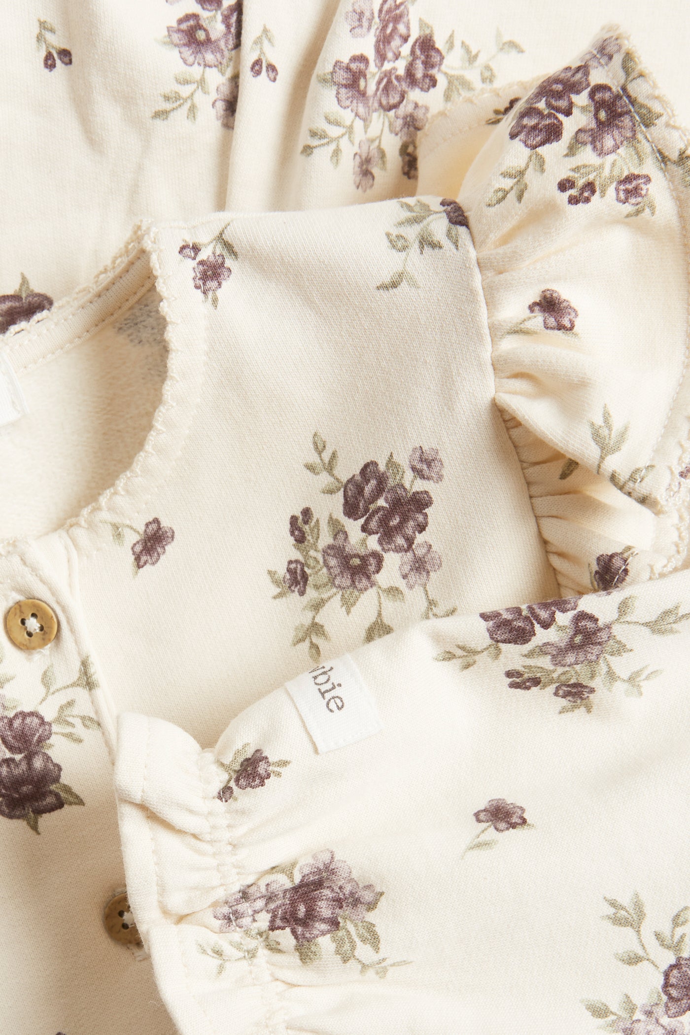 Baby beige floral jumpsuit with frills