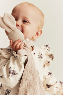 Baby beige floral jumpsuit with frills