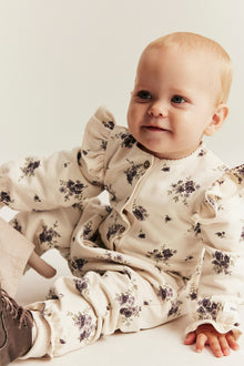 Baby beige floral jumpsuit with frills