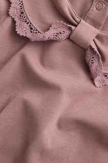 Baby pink bodysuit with bow collar