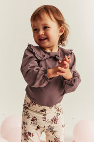 Baby pink bodysuit with bow collar