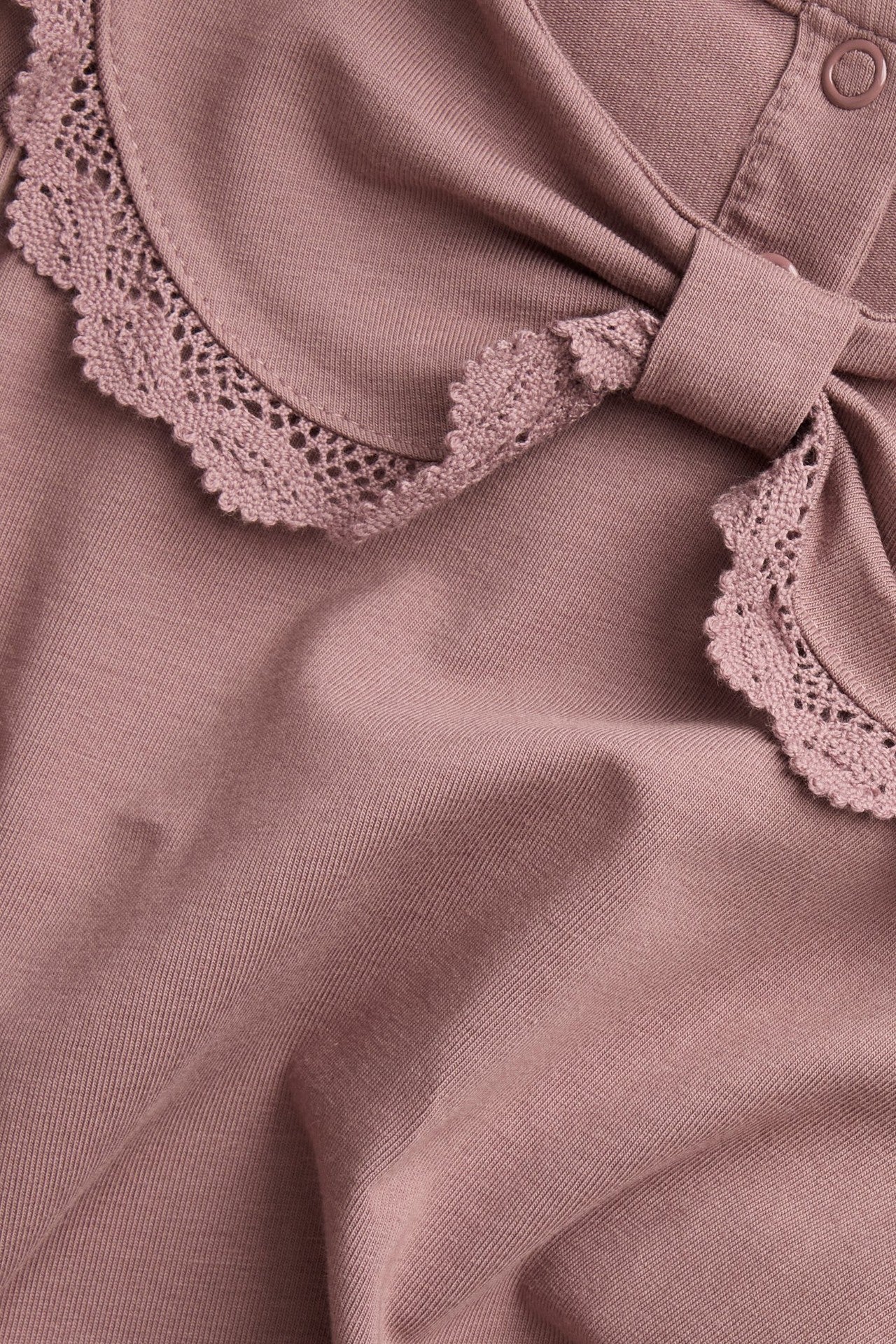 Kids' pink top with bow collar