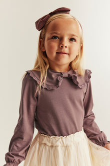 Kids' pink top with bow collar