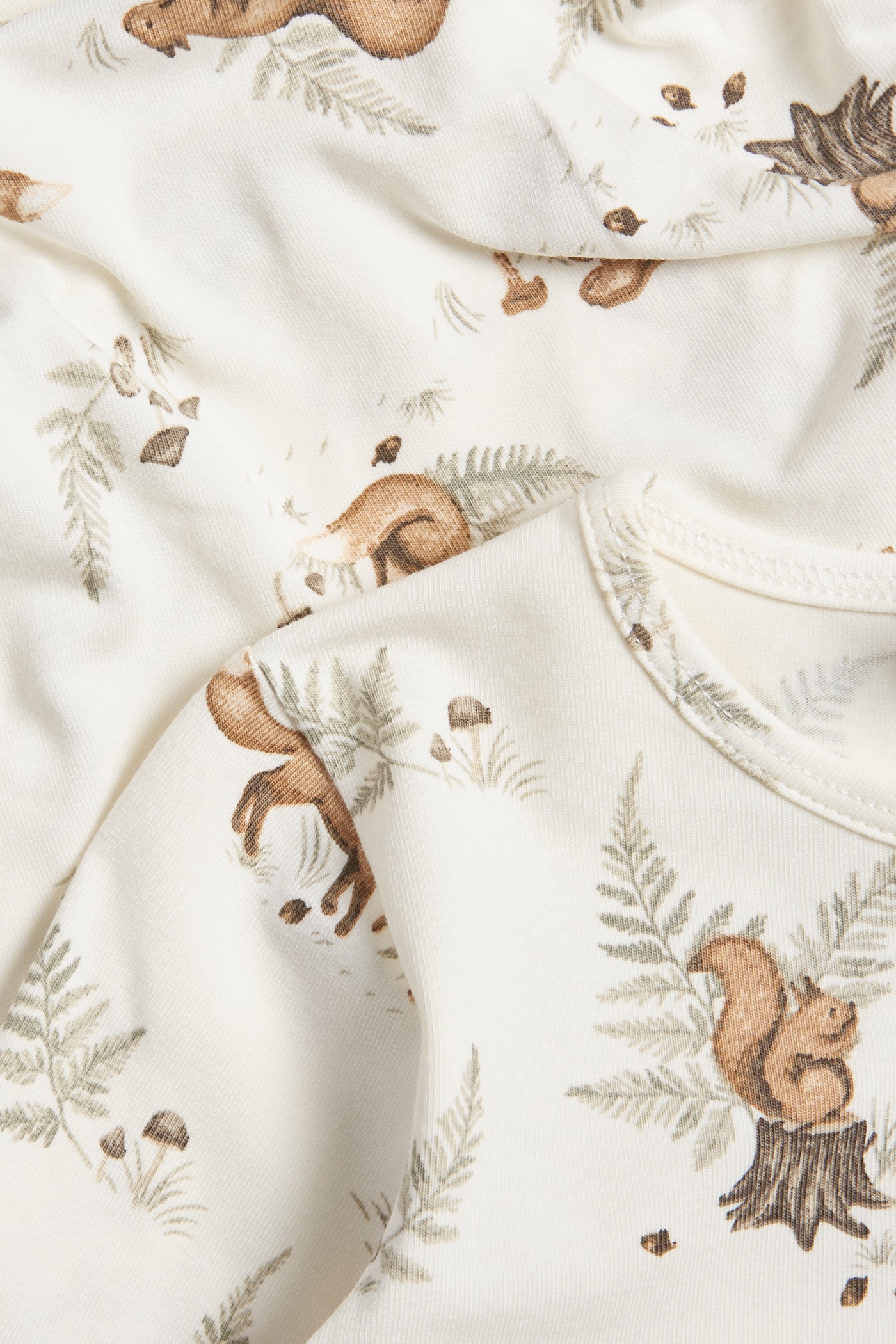Baby white bodysuit with animals