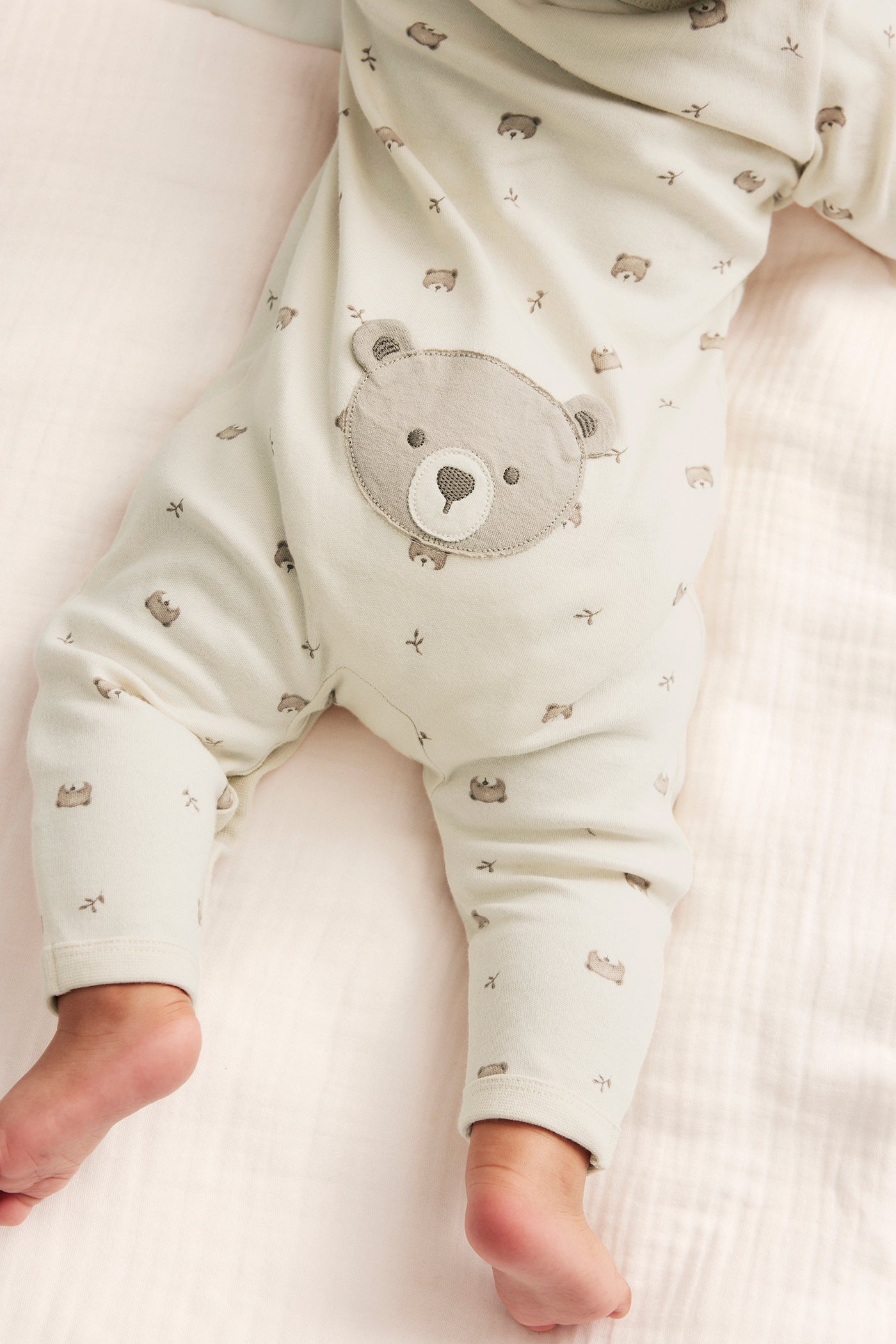 Baby beige sleepsuit with teddy bears