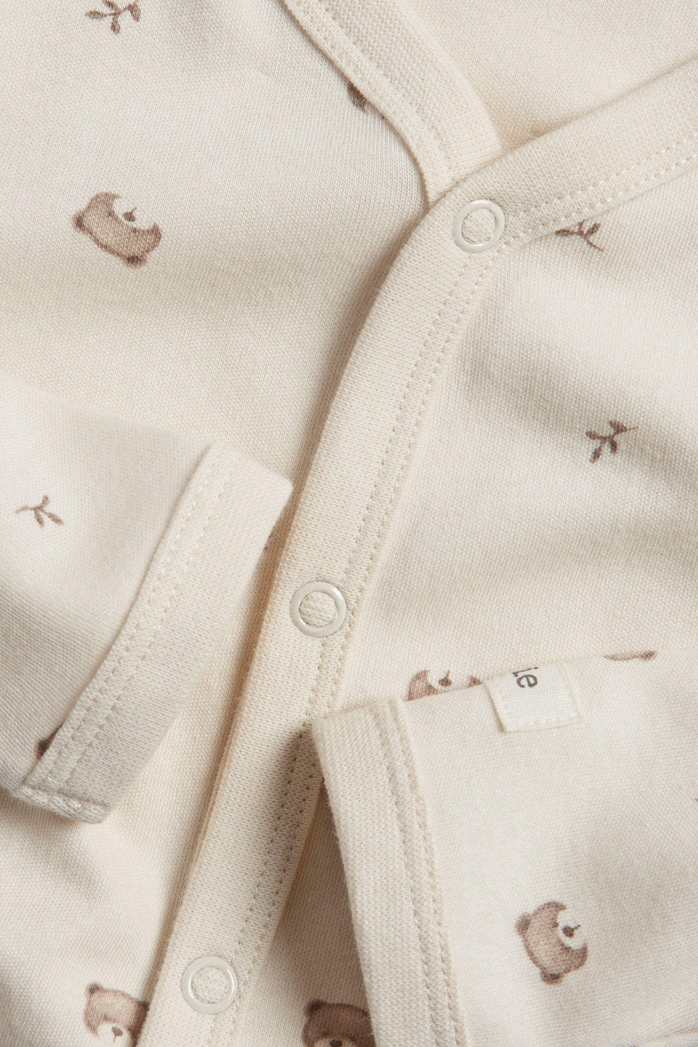 Baby beige sleepsuit with teddy bears