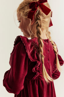 Kids´ red velour dress with frills