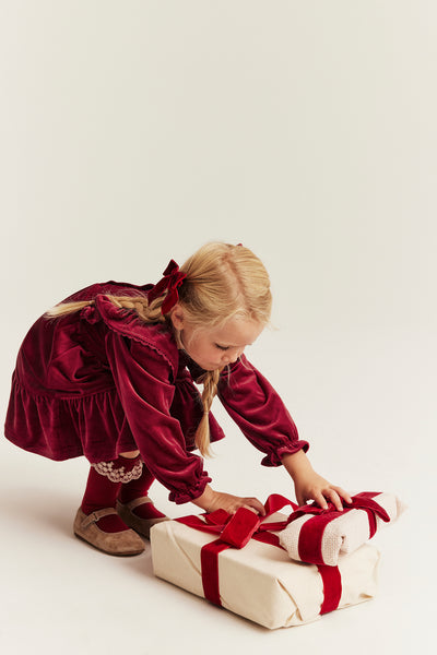 Kids´ red velour dress with frills