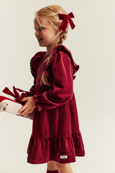 Kids´ red velour dress with frills