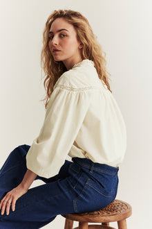 Women's beige blouse with embroidery