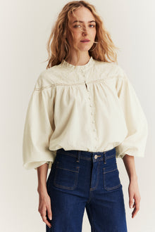 Women's beige blouse with embroidery