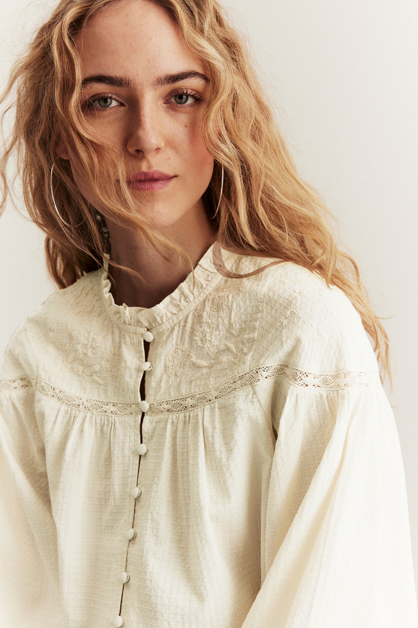 Women's beige blouse with embroidery