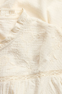 Women's beige blouse with embroidery