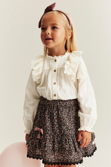 Kids' white blouse with embroidered frills