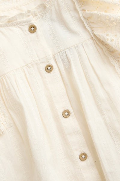 Kids' white blouse with embroidered frills