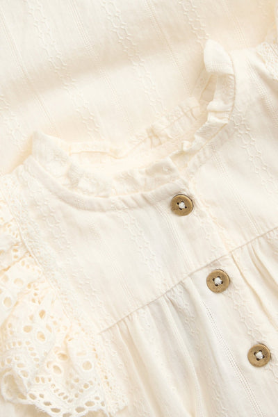 Baby white bodysuit with embroidered frills