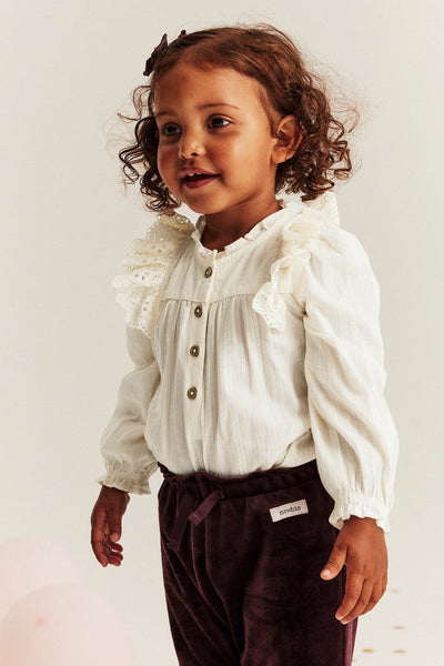 Baby white bodysuit with embroidered frills