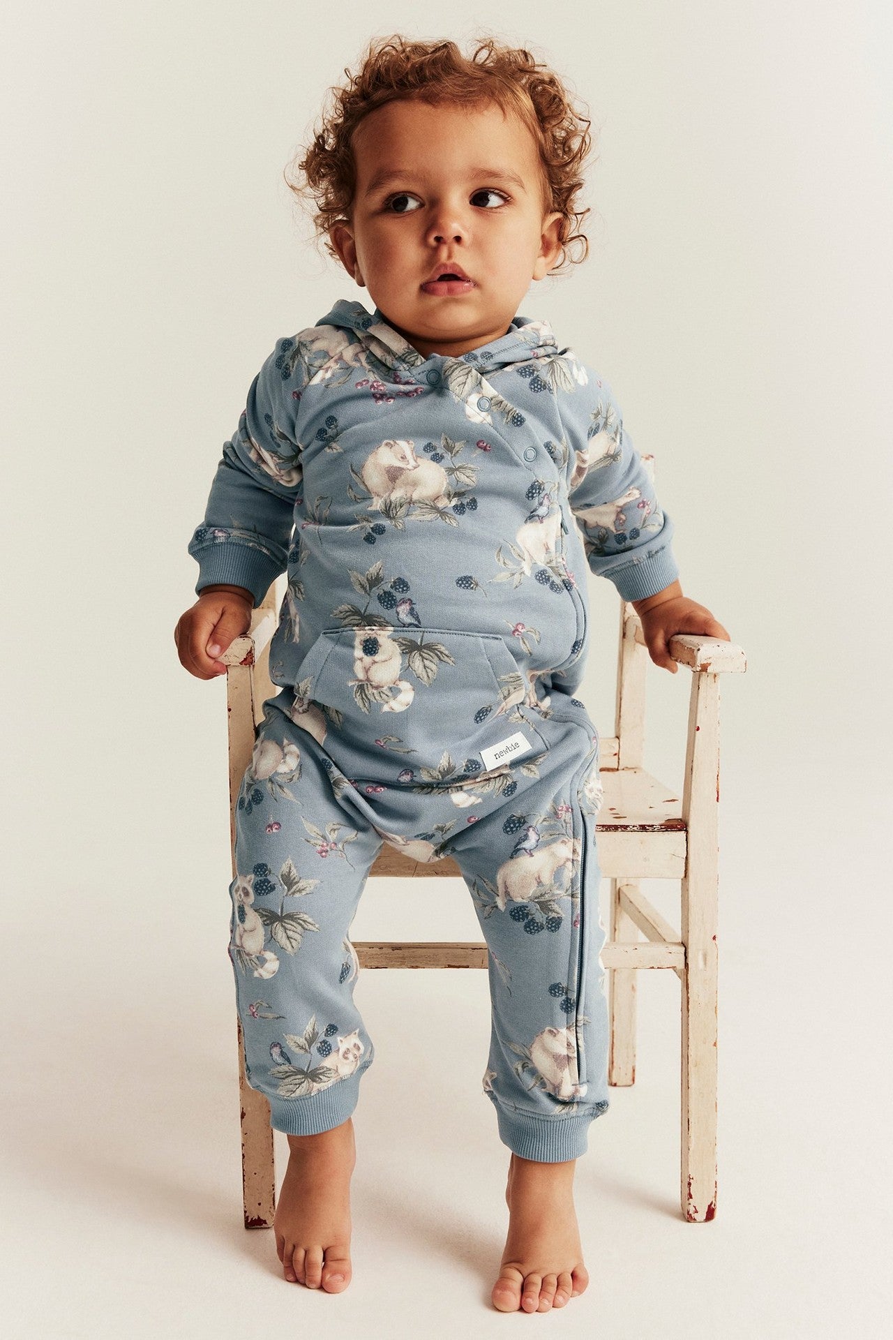 Baby blue raccoon onesie