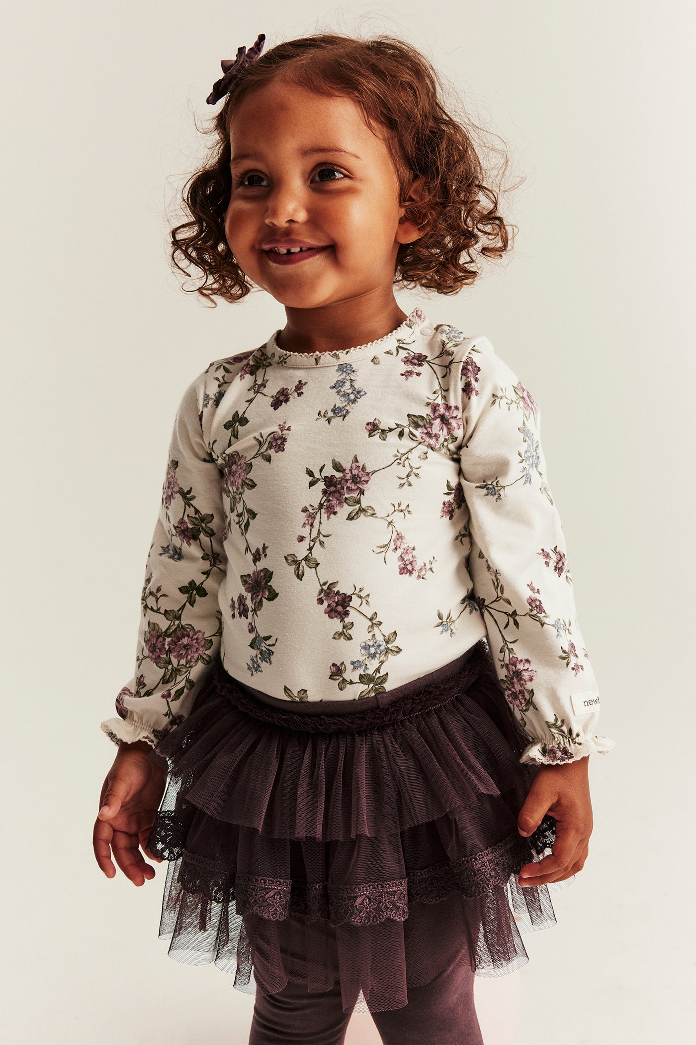 Baby beige floral bodysuit with puff sleeves