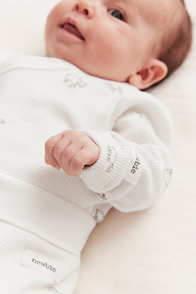 Baby white bodysuit with lamb print