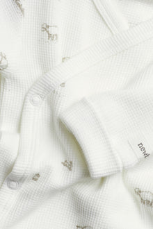 Baby white bodysuit with lamp print