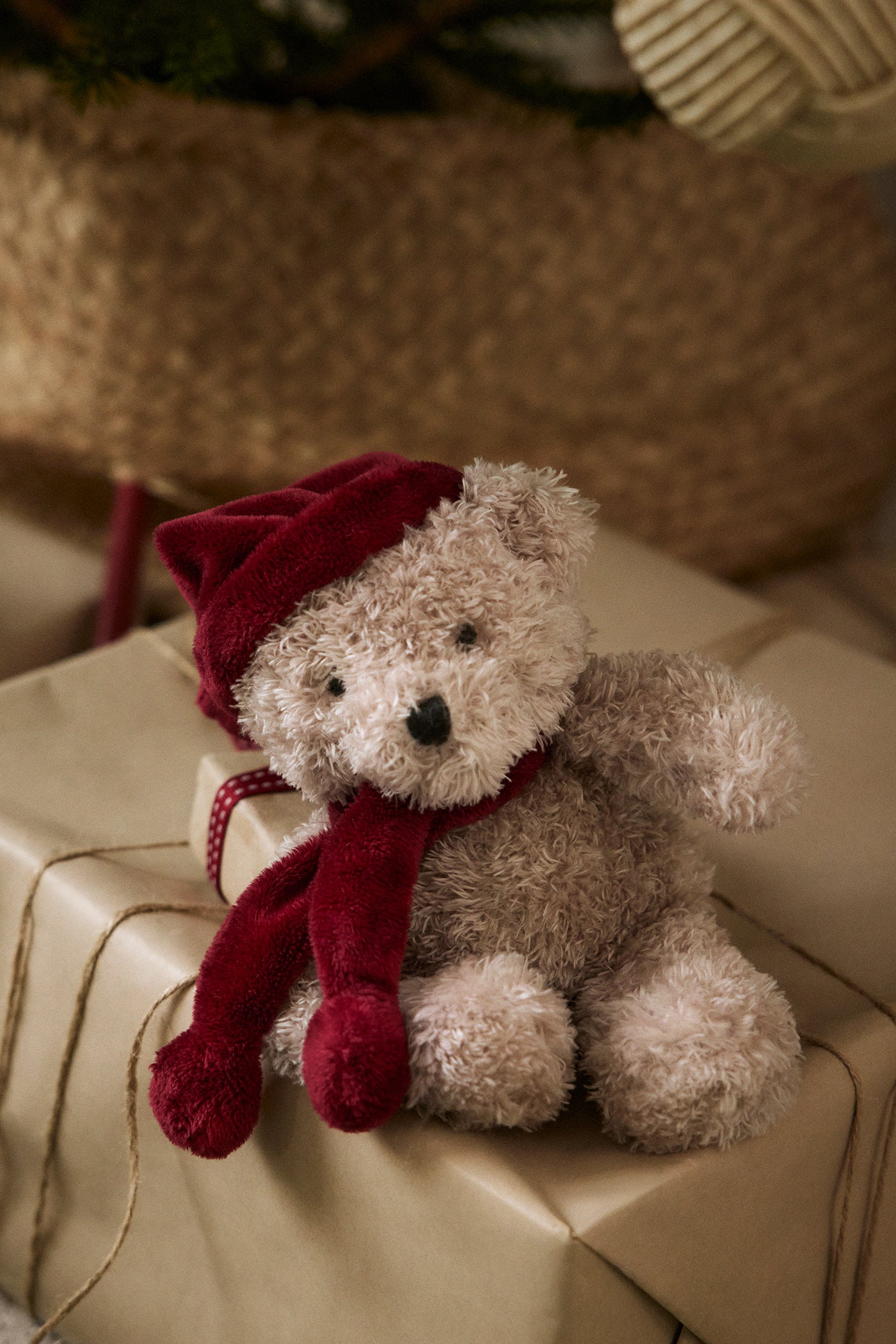 Baby red teddy bear with a Santa hat