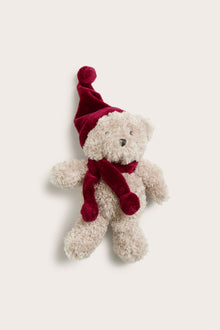 Baby red teddy bear with a Santa hat