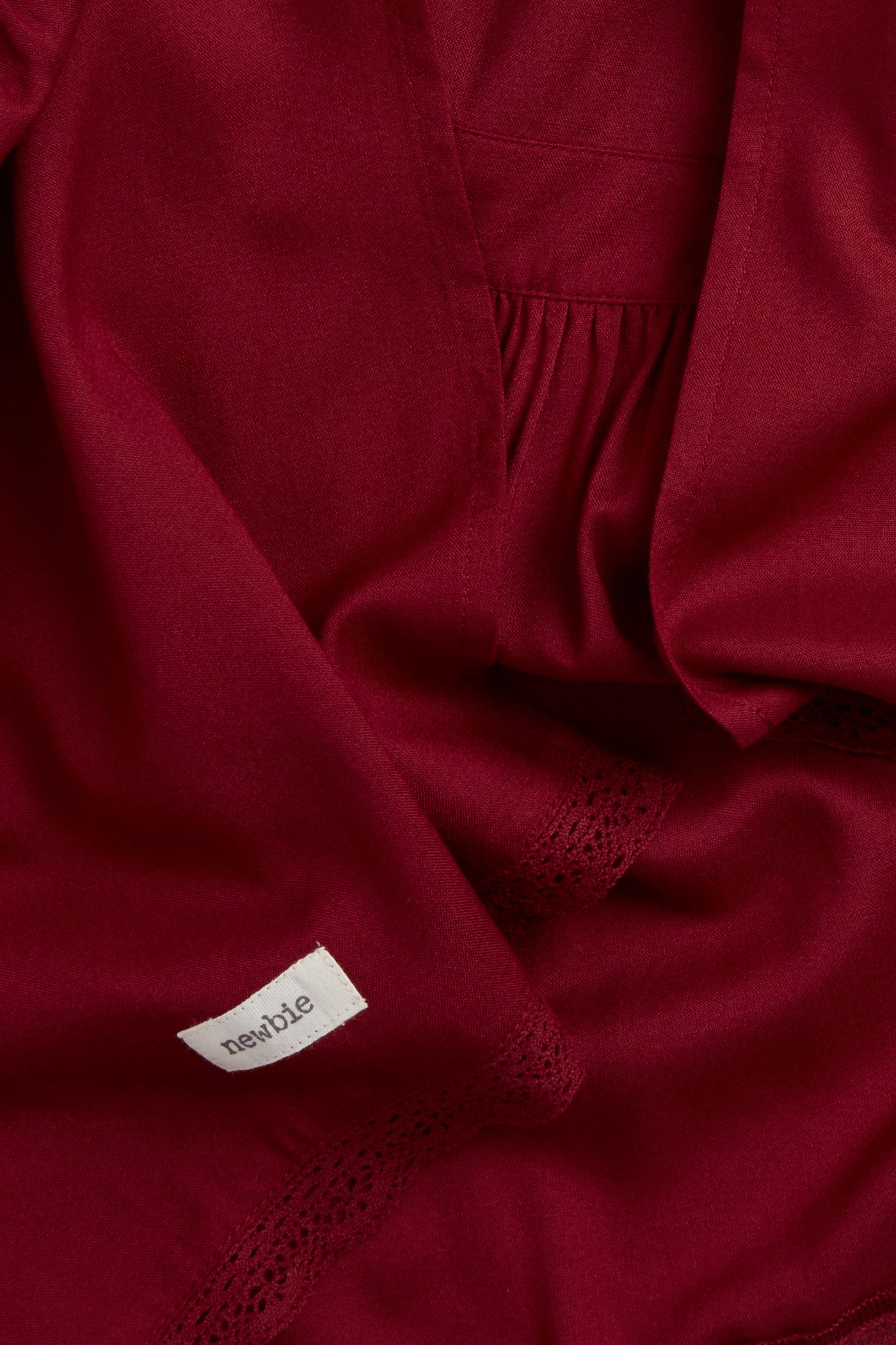 Kids' red apron with frill detail