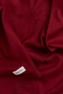 Kids' red apron with frill detail