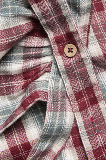 Women's red checked apron with frill detail