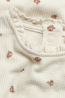 Baby beige floral bodysuit with lace