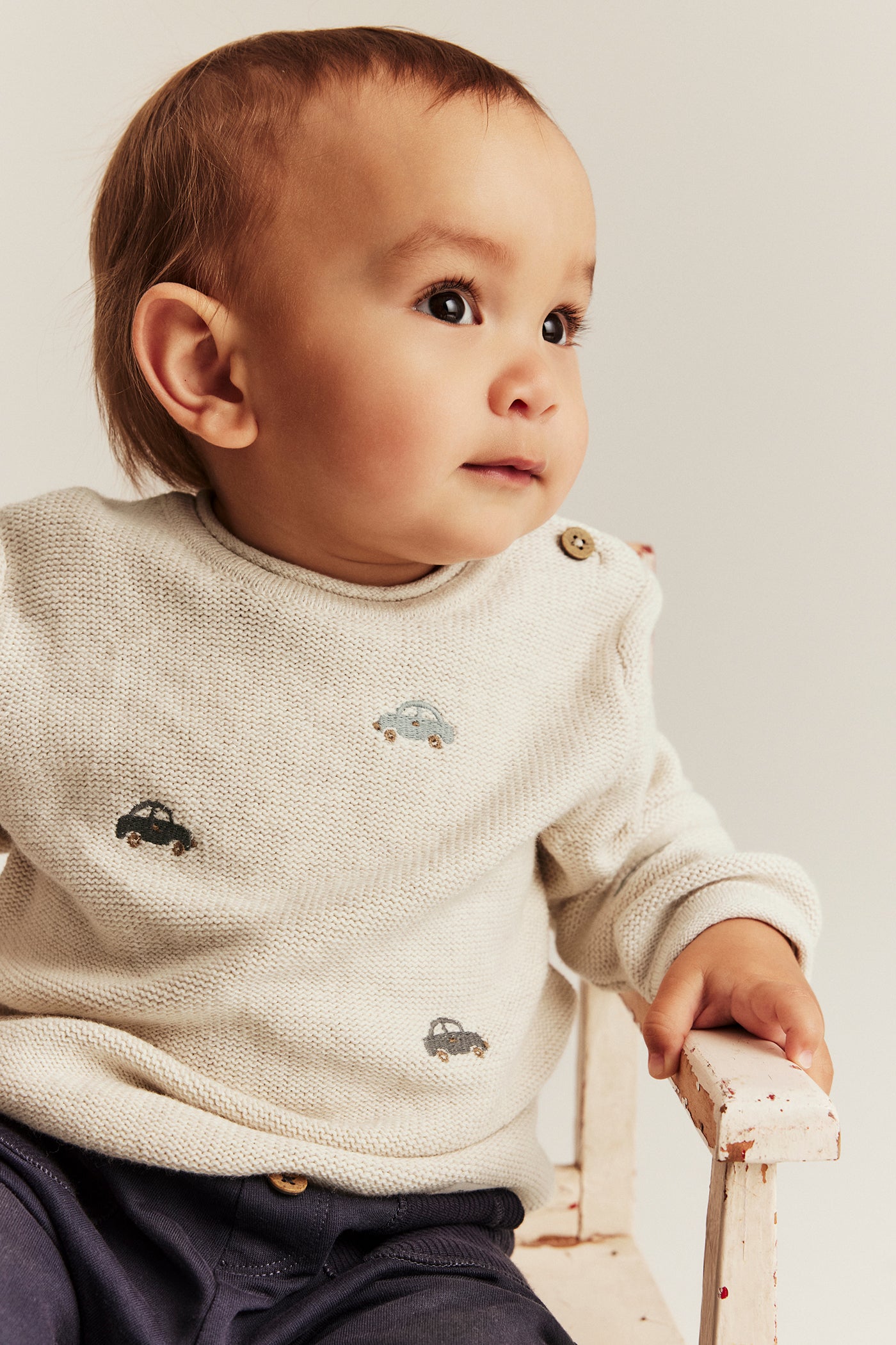 Baby beige knitted jumper with cars