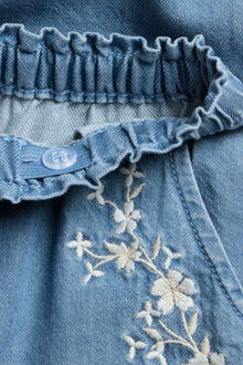 Baby blue denim trousers with floral embroidery