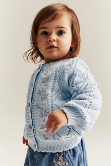 Baby blue knitted cardigan with flowers