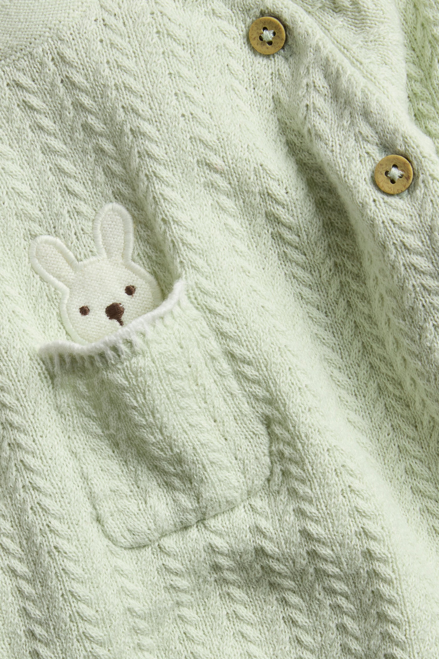 Baby green knitted cardigan with rabbit appliqué