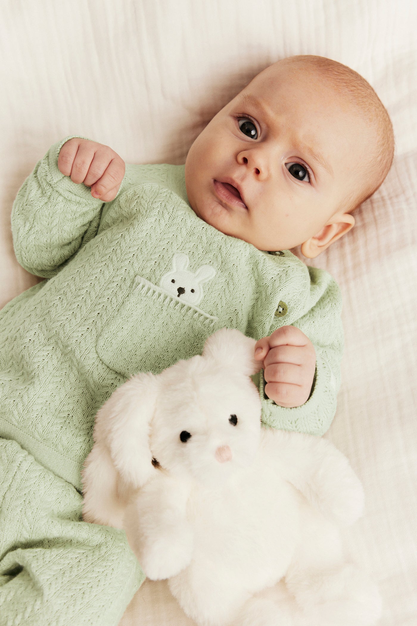 Baby green knitted cardigan with rabbit appliqué