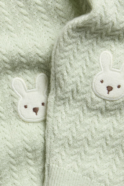 Baby green knitted leggings with rabbit appliqué