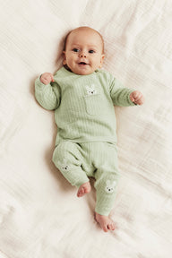 Baby green knitted leggings with rabbit appliqué