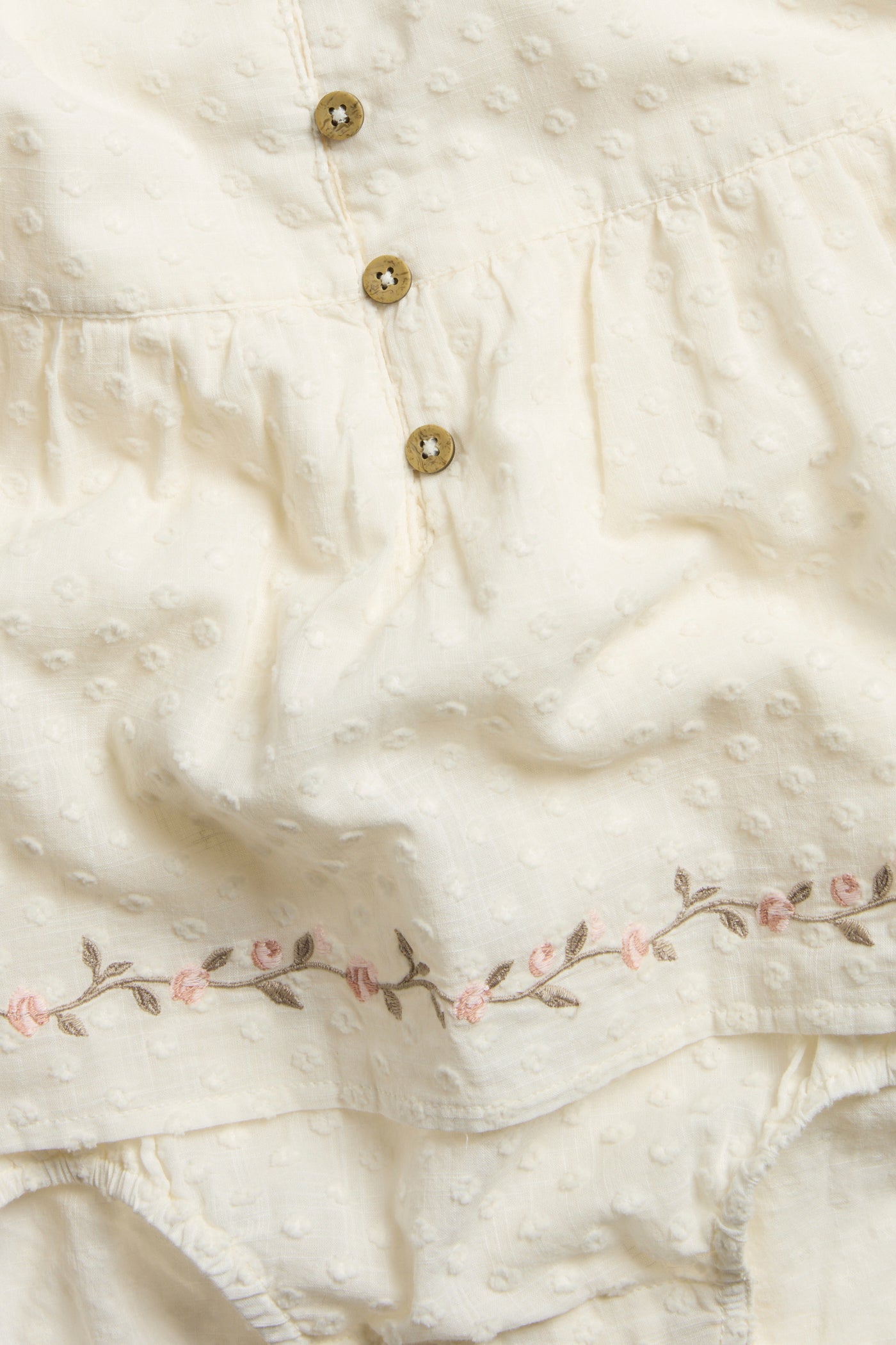 Baby white floral woven bodysuit with frills