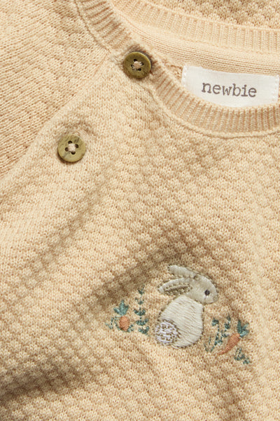 Baby orange knitted jumpsuit with embroidered rabbit