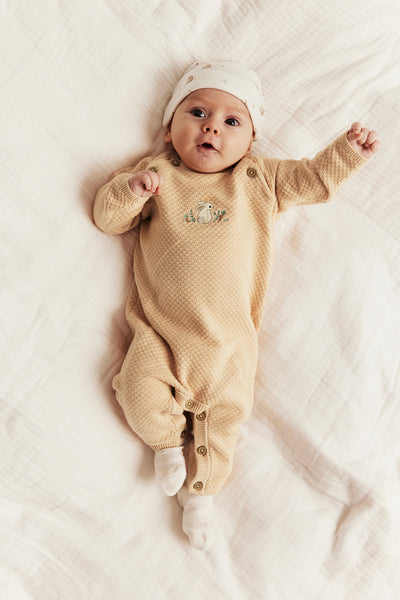 Baby orange knitted jumpsuit with embroidered rabbit