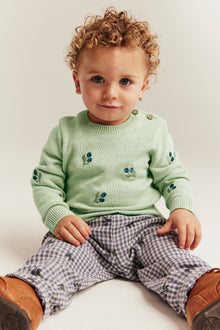 Baby green knitted jumper with blueberries