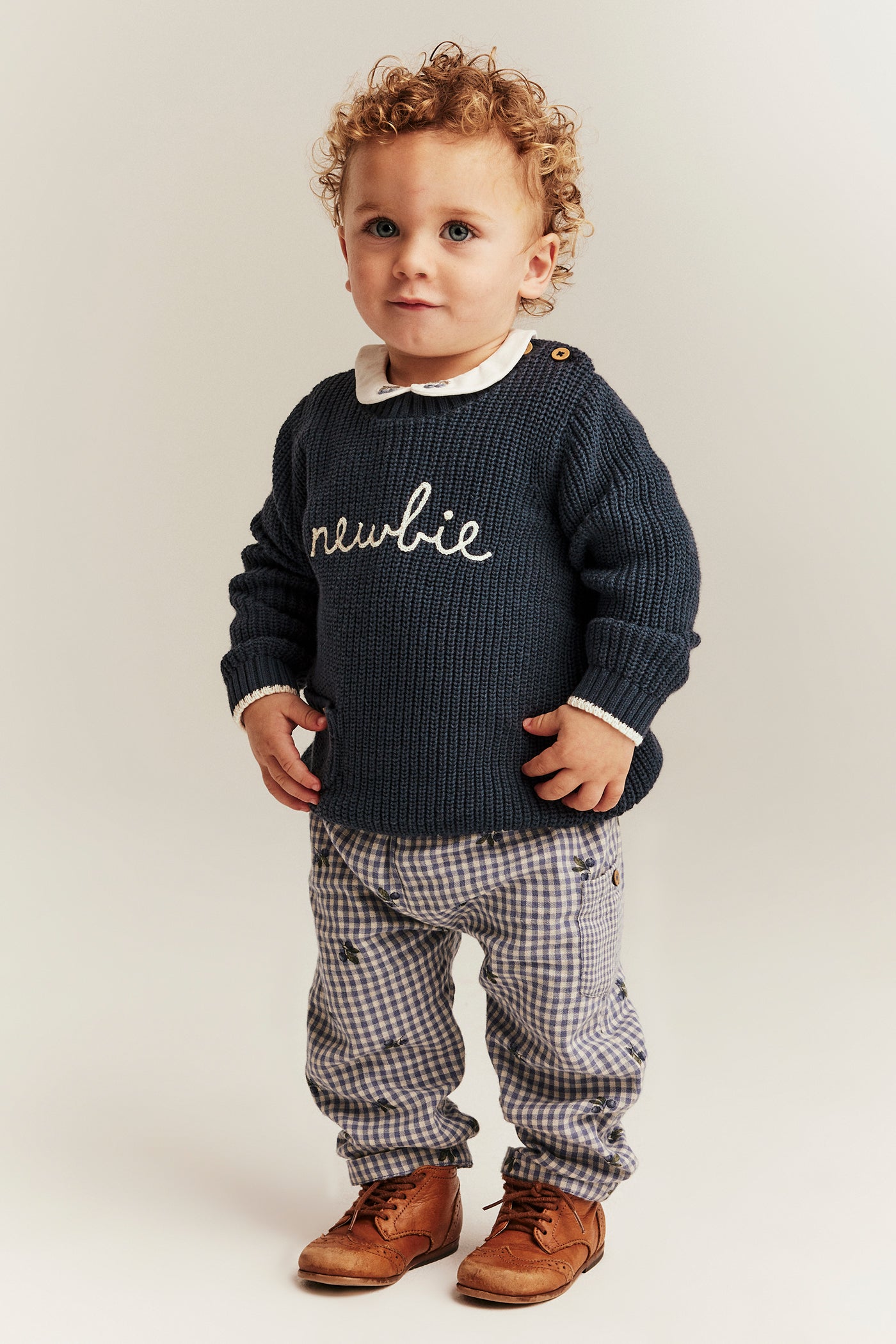 Baby blue knitted jumper with Newbie logo