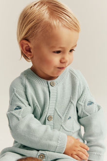 Baby green knitted jumpsuit with cars